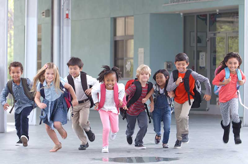 Group of young kids running together