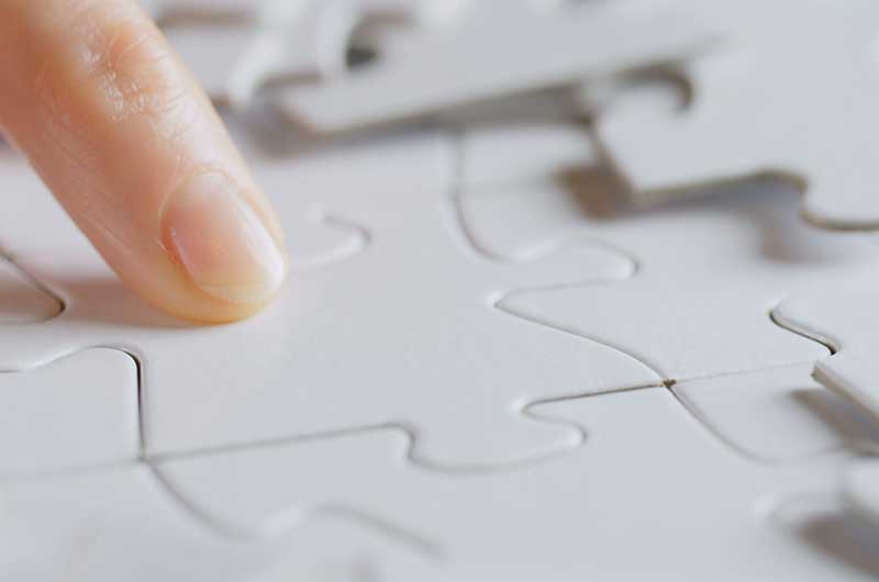 smallversion_female-hand-fitting-a-missing-jigsaw-puzzle-in-the-correct-hole-SBI-349578696